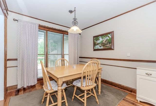 529 Arnold Rd, Lawrenceville, GA 30044 - dining area with light wood finished floors, crown molding, and baseboards
