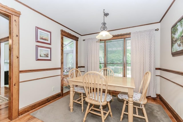529 Arnold Rd, Lawrenceville, GA 30044 - dining area with crown molding, wood finished floors, and baseboards