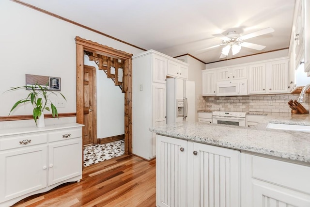 529 Arnold Rd, Lawrenceville, GA 30044 - kitchen featuring white appliances, a ceiling fan, a sink, white cabinets, and light wood finished floors