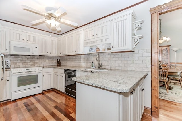 529 Arnold Rd, Lawrenceville, GA 30044 - kitchen featuring white appliances, a sink, a peninsula, open shelves, and light wood-style floors
