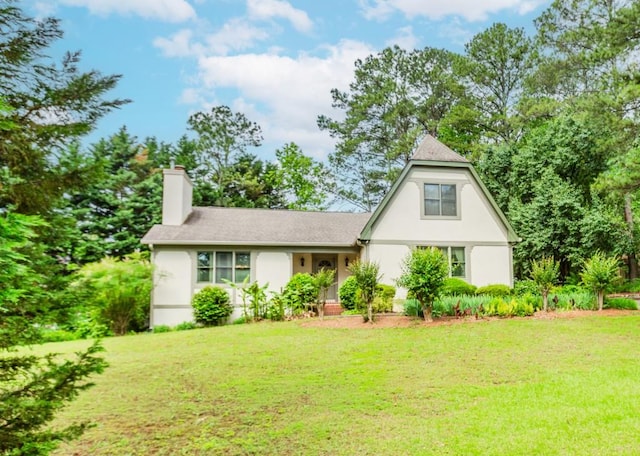 529 Arnold Rd, Lawrenceville, GA 30044 - view of front of home featuring a chimney, stucco siding, and a front yard