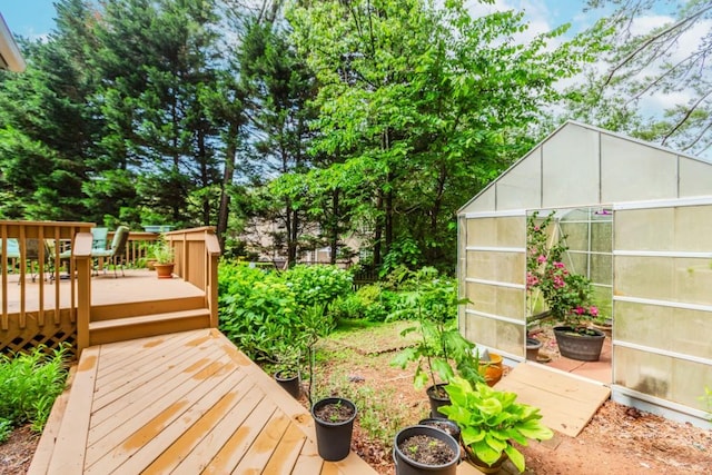 529 Arnold Rd, Lawrenceville, GA 30044 - wooden deck featuring an exterior structure and an outbuilding