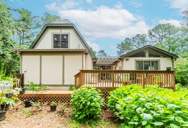 529 Arnold Rd, Lawrenceville, GA 30044 - back of house featuring stucco siding and a wooden deck