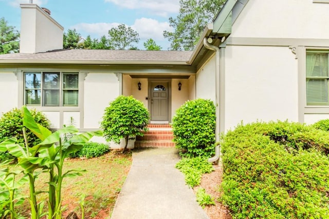 529 Arnold Rd, Lawrenceville, GA 30044 - property entrance with stucco siding and a chimney