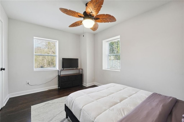 bedroom featuring ceiling fan and dark hardwood / wood-style flooring