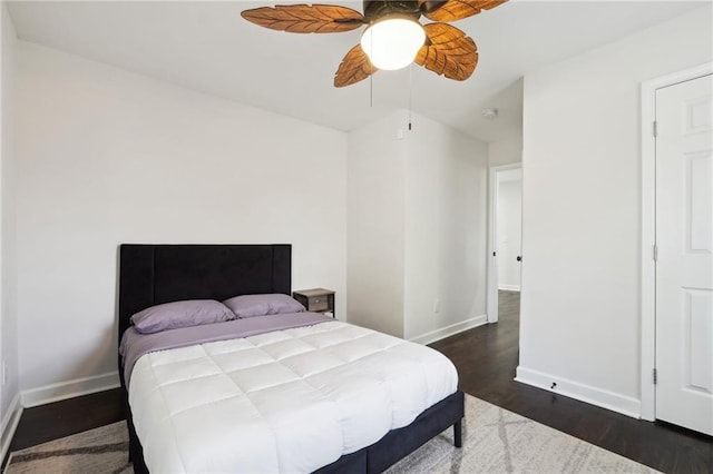 bedroom featuring ceiling fan and dark hardwood / wood-style flooring