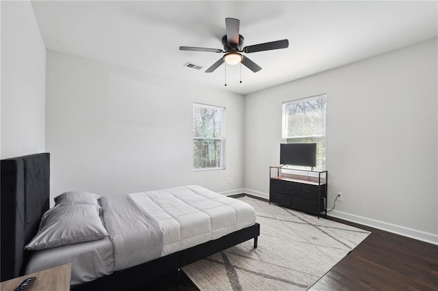 bedroom with hardwood / wood-style flooring and ceiling fan