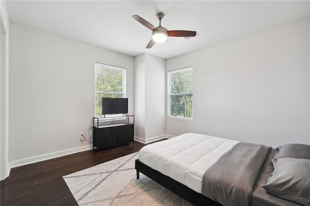 bedroom featuring ceiling fan and dark wood-type flooring