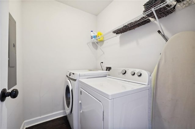 laundry area with separate washer and dryer, electric panel, and dark hardwood / wood-style floors