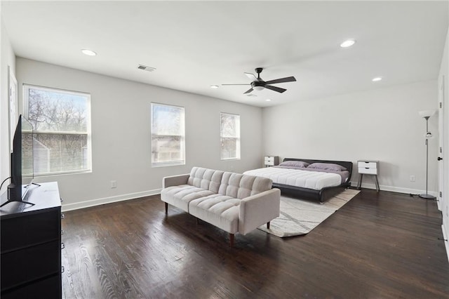 bedroom with hardwood / wood-style floors and ceiling fan