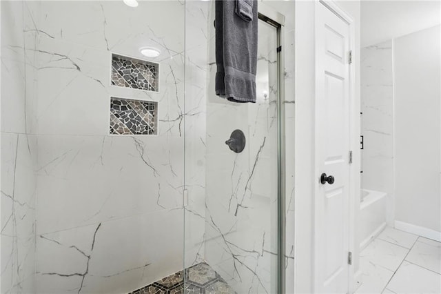 bathroom with tiled shower