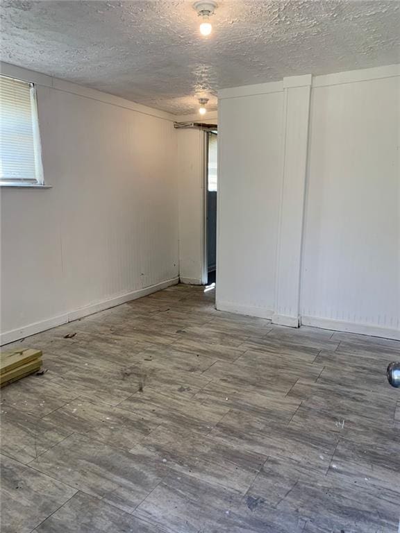 spare room with a textured ceiling