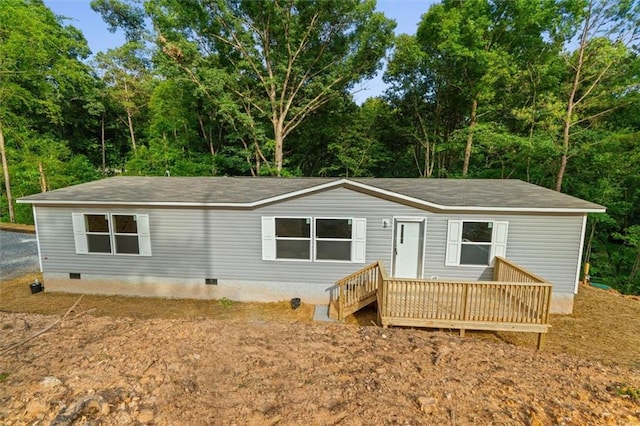 211 Fire Tower Rd NE, Calhoun, GA 30701 - view of front facade featuring crawl space, a shingled roof, and a deck