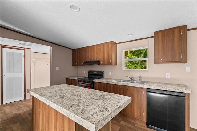 211 Fire Tower Rd NE, Calhoun, GA 30701 - kitchen with black appliances, a sink, under cabinet range hood, light countertops, and dark wood-style floors