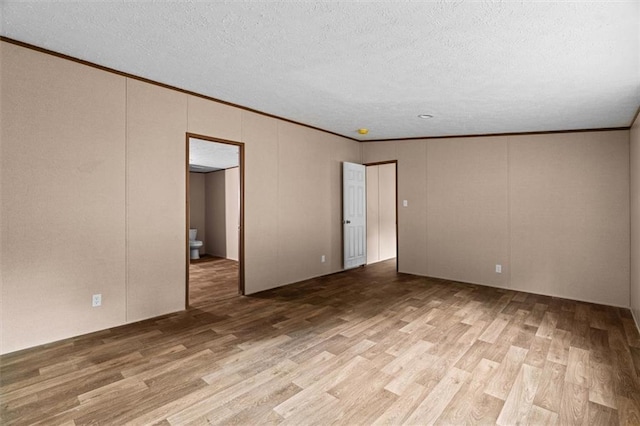 211 Fire Tower Rd NE, Calhoun, GA 30701 - spare room with wood finished floors, crown molding, and a textured ceiling