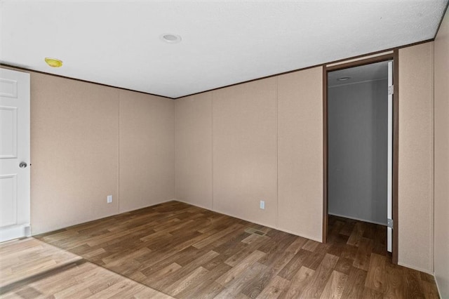 211 Fire Tower Rd NE, Calhoun, GA 30701 - unfurnished bedroom with wood finished floors, a closet, and a spacious closet
