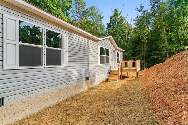 211 Fire Tower Rd NE, Calhoun, GA 30701 - view of side of home featuring crawl space and a deck