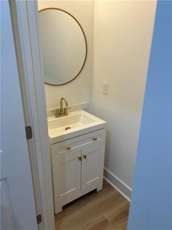 bathroom featuring hardwood / wood-style floors and vanity