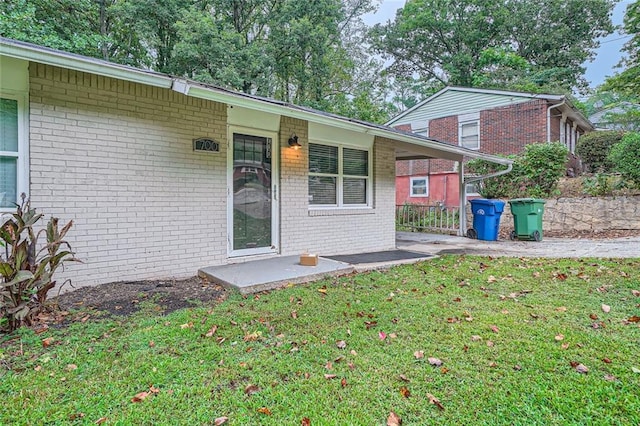 rear view of property with a yard