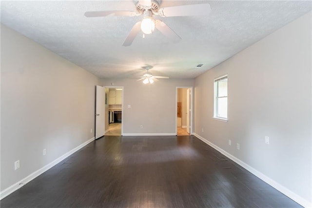 1615 Enchanted Forest Dr, Conley, GA 30288 - empty room featuring baseboards, a textured ceiling, ceiling fan, and dark wood-style floors