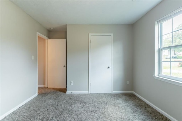 1615 Enchanted Forest Dr, Conley, GA 30288 - unfurnished bedroom featuring baseboards and carpet