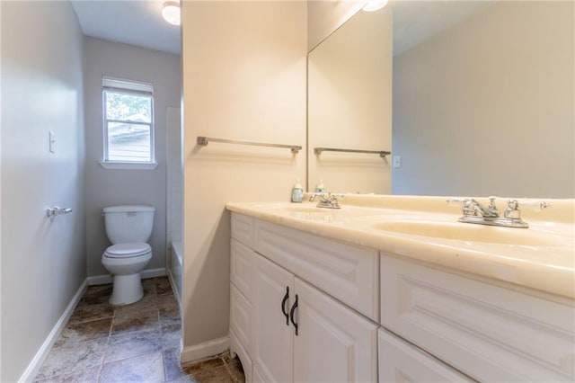 1615 Enchanted Forest Dr, Conley, GA 30288 - full bathroom featuring double vanity, toilet, baseboards, and a sink