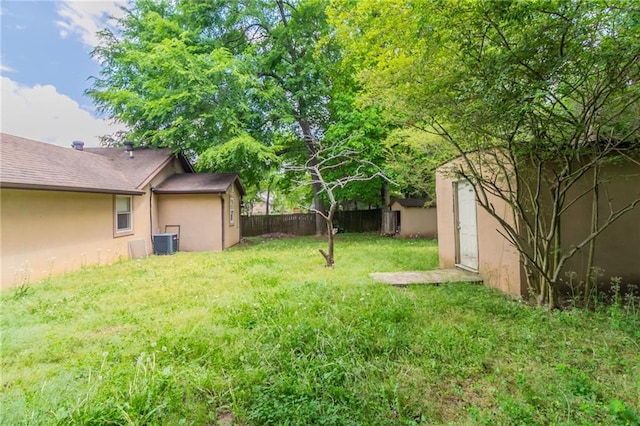 1615 Enchanted Forest Dr, Conley, GA 30288 - view of yard with an outbuilding, fence, cooling unit, and a storage unit
