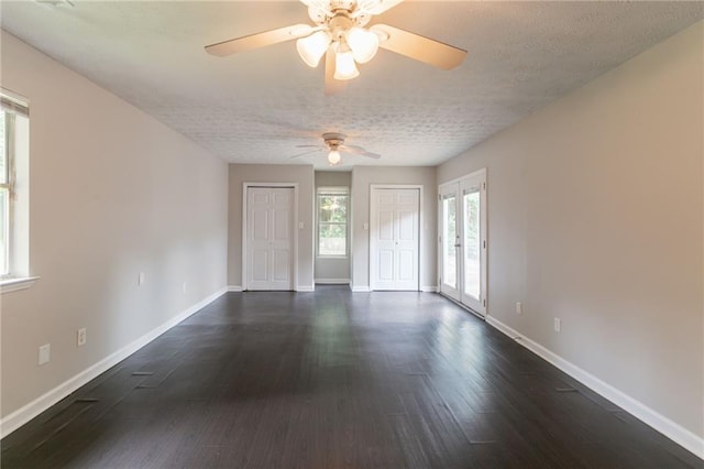 1615 Enchanted Forest Dr, Conley, GA 30288 - empty room featuring baseboards, ceiling fan, a textured ceiling, and dark wood-type flooring