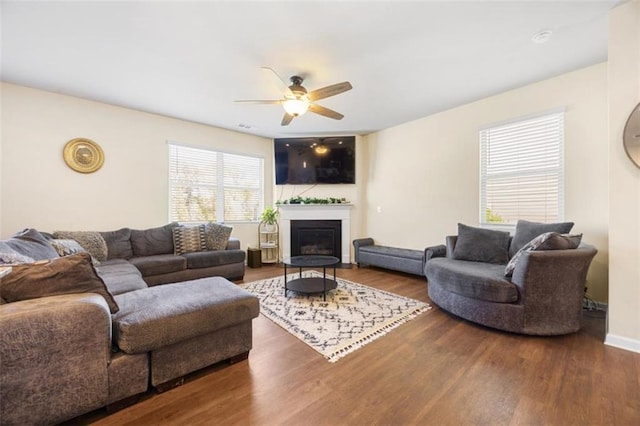 111 Centennial Ridge Dr, Acworth, GA 30102 - living area featuring baseboards, ceiling fan, a glass covered fireplace, and wood finished floors