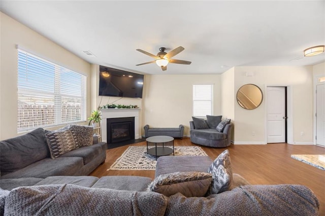 111 Centennial Ridge Dr, Acworth, GA 30102 - living room with ceiling fan, visible vents, wood finished floors, baseboards, and a glass covered fireplace