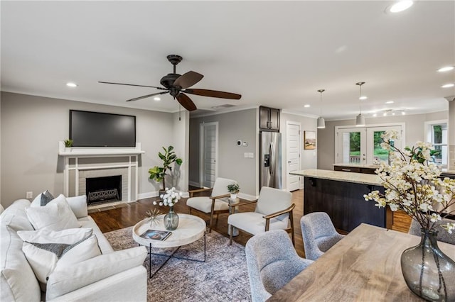 1735 Jobeth Ave SE, Atlanta, GA 30316 - living room featuring recessed lighting, ceiling fan, wood finished floors, a fireplace with flush hearth, and ornamental molding