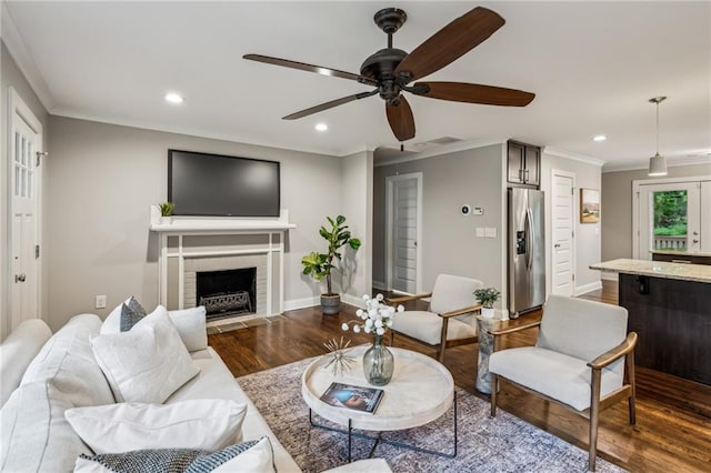 1735 Jobeth Ave SE, Atlanta, GA 30316 - living room featuring dark wood-style floors, ornamental molding, recessed lighting, a ceiling fan, and a fireplace