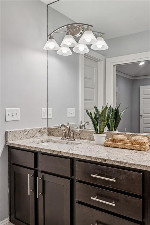 1735 Jobeth Ave SE, Atlanta, GA 30316 - bathroom with vanity and a chandelier