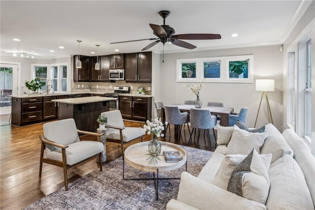 1735 Jobeth Ave SE, Atlanta, GA 30316 - living area with recessed lighting, ceiling fan, wood finished floors, and crown molding