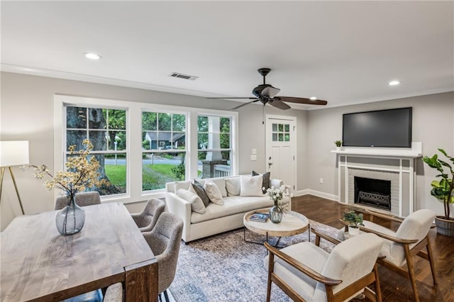 1735 Jobeth Ave SE, Atlanta, GA 30316 - living room with wood finished floors, recessed lighting, a ceiling fan, ornamental molding, and a brick fireplace
