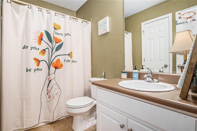 bathroom with vanity, toilet, a shower with curtain, and tile patterned flooring