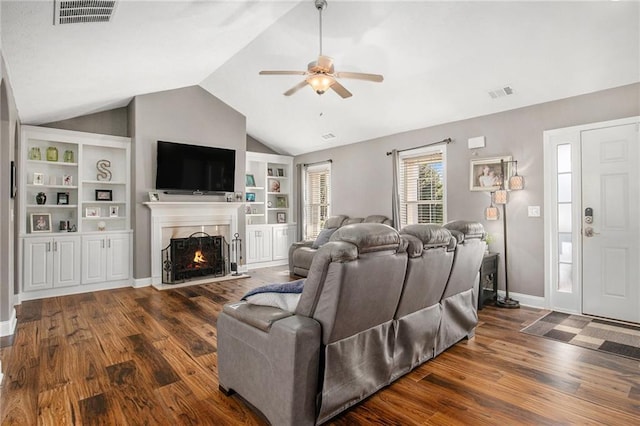 1414 Blanding Way, Winder, GA 30680 - living room featuring lofted ceiling, wood finished floors, visible vents, and ceiling fan