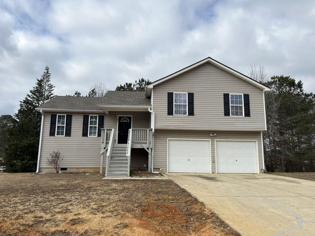 split level home with a garage