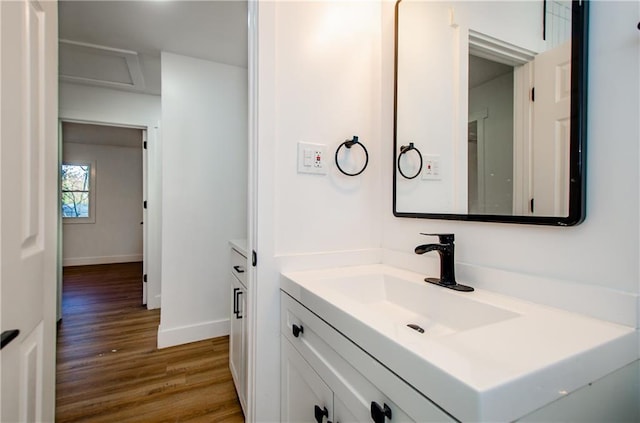 bathroom with hardwood / wood-style floors and vanity