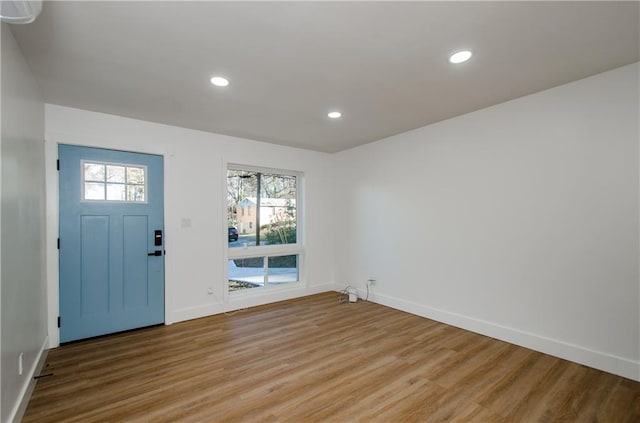 entrance foyer with light wood-type flooring and a healthy amount of sunlight