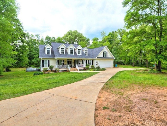 cape cod house with a porch, a garage, a front yard, and concrete driveway
