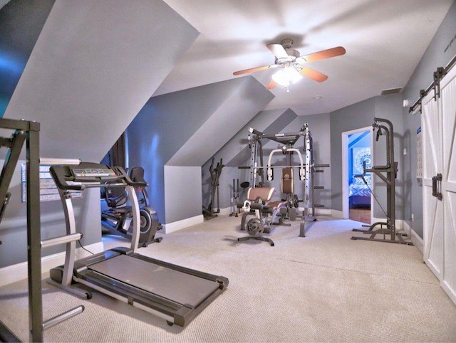workout area with baseboards, ceiling fan, and carpet flooring
