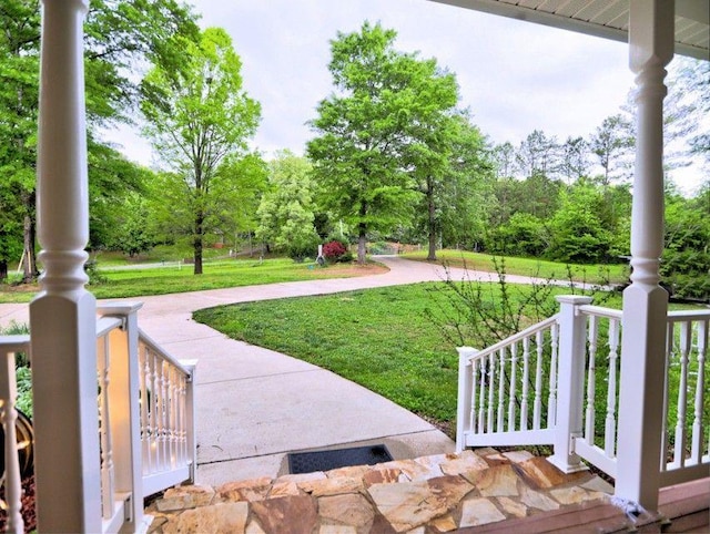 view of yard with covered porch