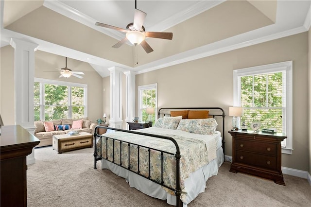 carpeted bedroom featuring a ceiling fan, ornate columns, and multiple windows