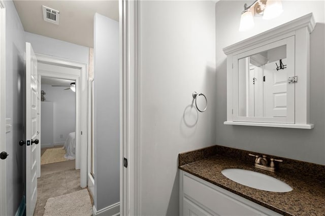 bathroom with ensuite bath, visible vents, and vanity