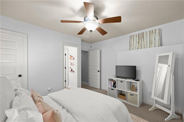 bedroom with baseboards, a ceiling fan, carpet flooring, and visible vents