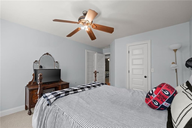 bedroom featuring carpet, baseboards, and ceiling fan