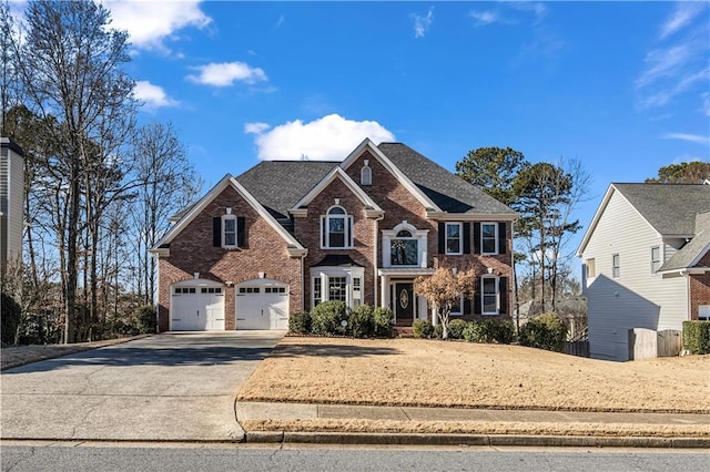 front of property with a garage