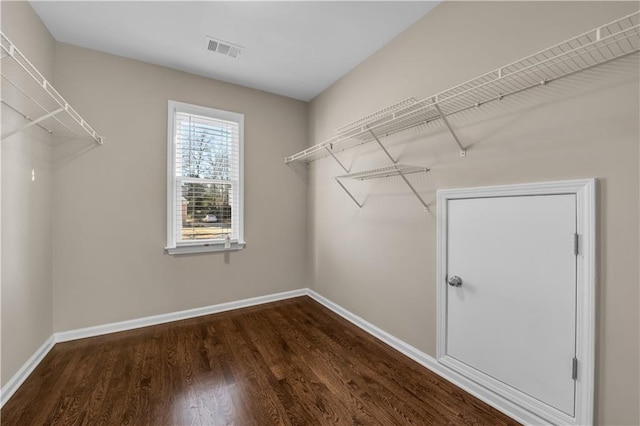 spacious closet featuring hardwood / wood-style floors