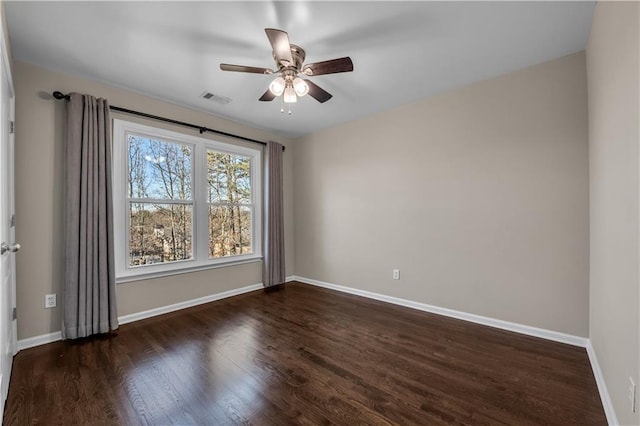 unfurnished room featuring ceiling fan and dark hardwood / wood-style floors